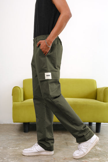 Olive cargo pants with utility pockets from Bonkers Corner, featuring a relaxed fit and practical design.