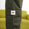 Olive cargo pants with utility pockets from Bonkers Corner, showcasing multiple functional pockets and relaxed fit.