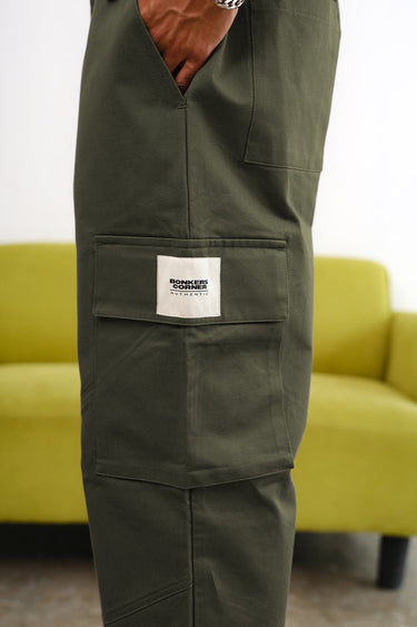 Olive cargo pants with utility pockets from Bonkers Corner, showcasing multiple functional pockets and relaxed fit.