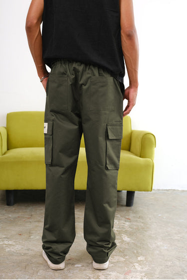 Olive green cargo pants with utility pockets from Bonkers Corner, featuring a relaxed fit and functional pocket design.