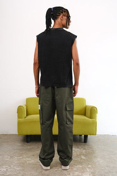 Olive cargo pants with utility pockets from Bonkers Corner, featuring a relaxed fit and multiple functional pockets.