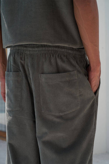 Bonkers Corner olive corduroy pants in size XS, featuring textured fabric and a classic fit, displayed on a neutral background.
