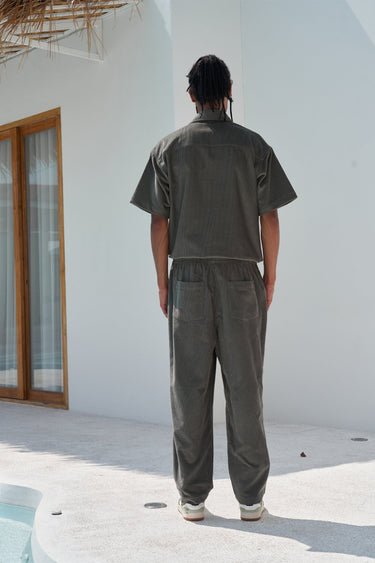 Bonkers Corner olive corduroy pants shown in XS size, featuring textured fabric and classic fit for casual wear.