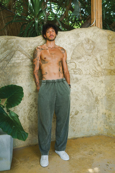Olive faded loose fit pants by Bonkers Corner, shown in a relaxed style with a comfortable, casual fit and distressed fabric.