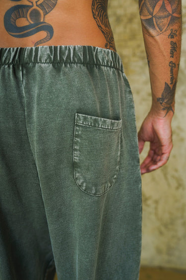 Bonkers Corner olive faded loose fit pants featuring a relaxed style and casual design, shown on a neutral background.