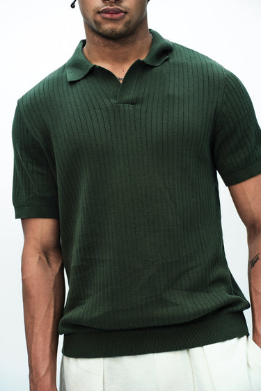 Bonkers Corner Olive Knit Polo T-shirt, close-up of green knitted fabric with collar and button details.