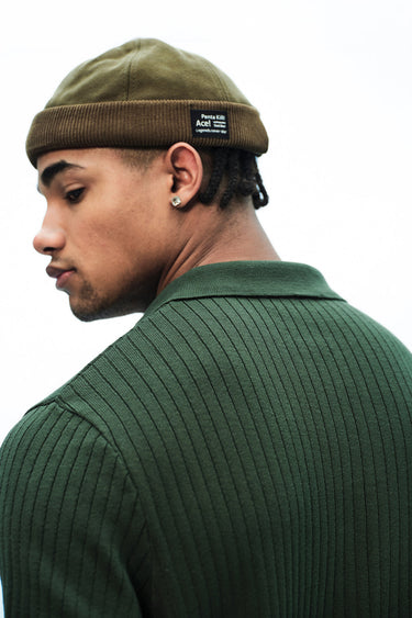 Olive green knit polo T-shirt by Bonkers Corner, featuring a classic collar and short sleeves, casual and stylish for everyday wear.