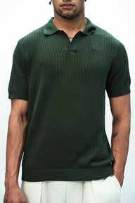 Olive green knit polo T-shirt by Bonkers Corner, featuring a classic collar and short sleeves for a casual, stylish look.