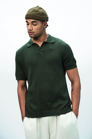 Olive green knit polo T-shirt by Bonkers Corner, featuring a classic collar and short sleeves, displayed flat against a white background.