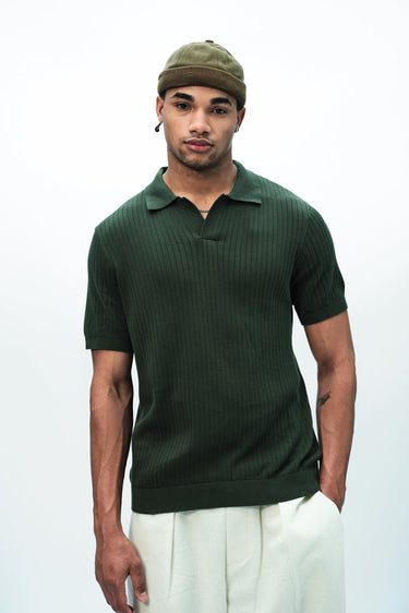 Olive green knit polo T-shirt by Bonkers Corner, featuring a classic collar and short sleeves, displayed on a white background.