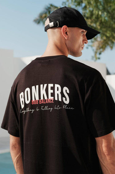 Bonkers Corner ONYX Classic oversized T-shirt made from 100% Supima cotton in white, displayed flat with a relaxed fit.