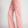 Peach pink wide-leg sweatpants by Bonkers Corner, featuring a comfortable fit and soft fabric, displayed on a neutral background.