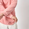 Pink collared sweatshirt from Bonkers Corner, featuring a soft fabric and casual style, shown on a model.
