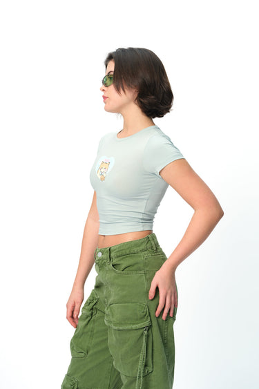Bonkers Corner Pisces Power long length baby tee in white, featuring a stylish graphic design and comfortable fit.