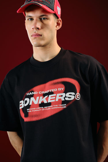 Black oversized T-shirt from Project: Bonkers by Bonkers Corner featuring a relaxed fit and bold graphic design.