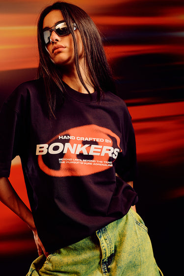 Black oversized T-shirt from Bonkers Corner featuring a relaxed fit and casual style, displayed on a plain background.
