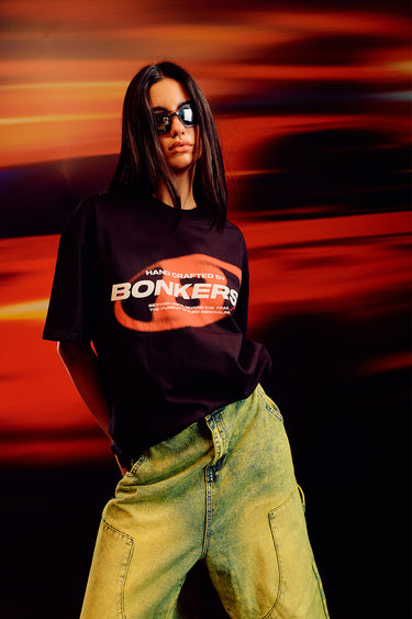 Black oversized T-shirt from Bonkers Corner featuring a relaxed fit and minimal design, ideal for casual streetwear style.