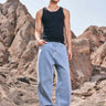 Pair of Bonkers Corner regular blue wide-leg straight jeans displayed on a model, showcasing the relaxed fit and classic denim style.