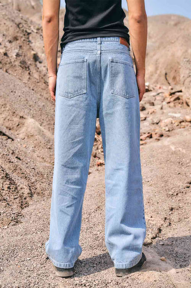 Pair of Bonkers Corner regular blue wide-leg straight jeans displayed on a model, showcasing the relaxed fit and classic denim style.