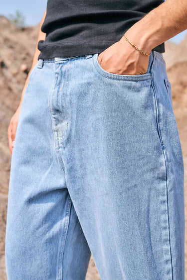 Regular blue wide-leg straight jeans by Bonkers Corner, shown hanging with a casual fit and classic denim texture.