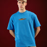 Bonkers Corner Ride In Style oversized T-shirt in white, featuring bold graphic design and relaxed fit for casual wear.