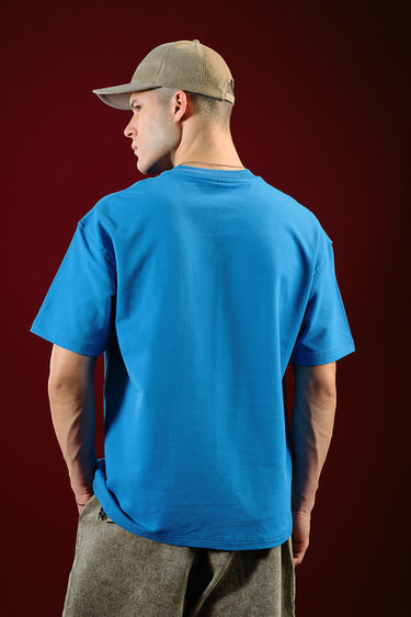 Bonkers Corner Ride In Style oversized T-shirt in white, featuring bold graphic design and relaxed fit for casual wear.