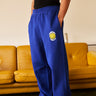 Royal blue straight fit sweatpants by Bonkers Corner, shown lying flat with elastic waistband and cuffed ankles.
