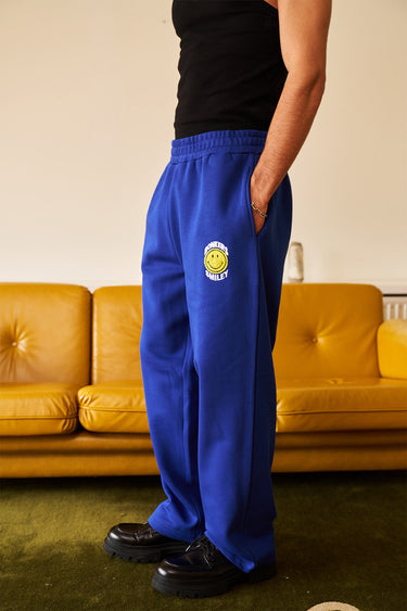 Royal blue straight fit sweatpants by Bonkers Corner, showing a comfortable, casual fit with elastic waistband and side pockets.