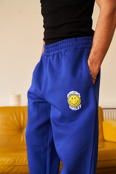 Royal blue straight fit sweatpants by Bonkers Corner, showing the relaxed fit and soft fabric on a plain background.