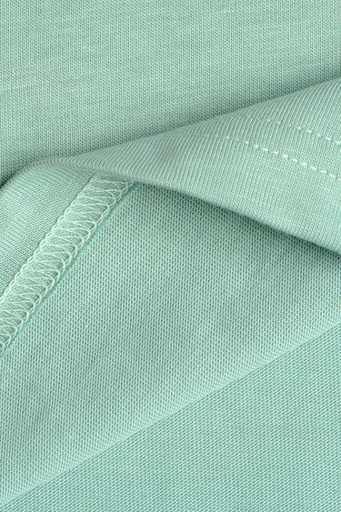 Sage green Supima cotton regular fit T-shirt by Bonkers Corner, close-up of fabric and neckline detail.