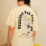 Light blue oversized T-shirt from Bonkers Corner featuring "Seeking The Positive" graphic design. Casual and comfortable fit.