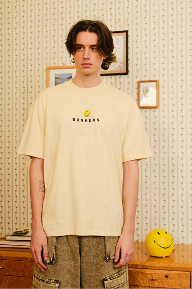 Bonkers Corner Seeking The Positive oversized T-shirt in XS with positive slogan and relaxed fit, front view.