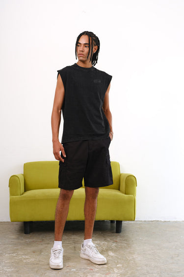 Bonkers Corner Signature Black Utility Shorts displayed on a model, featuring multiple pockets and a casual fit.
