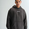 Dark grey melange hoodie from Bonkers Corner, featuring a relaxed fit and soft fabric, displayed on a hanger.