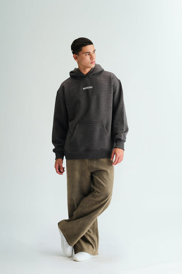 Bonkers Corner Signature Dark Grey Melange Hoodie shown on a model, featuring a relaxed fit and soft fabric.