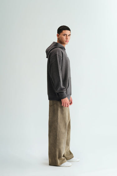 Bonkers Corner Signature Dark Grey Melange Hoodie shown on model, featuring a relaxed fit and soft fabric.