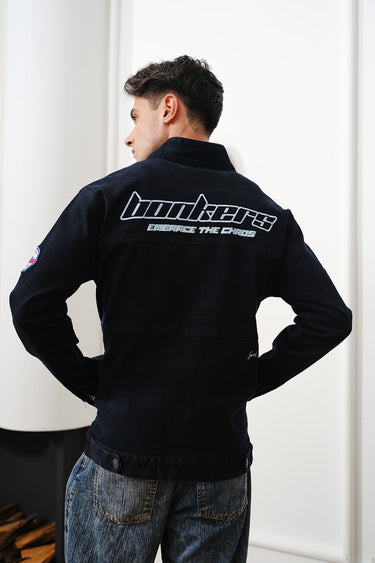 Bonkers Corner Signature Denim Jacket displayed on a hanger showing classic blue denim, button closure, and chest pockets.