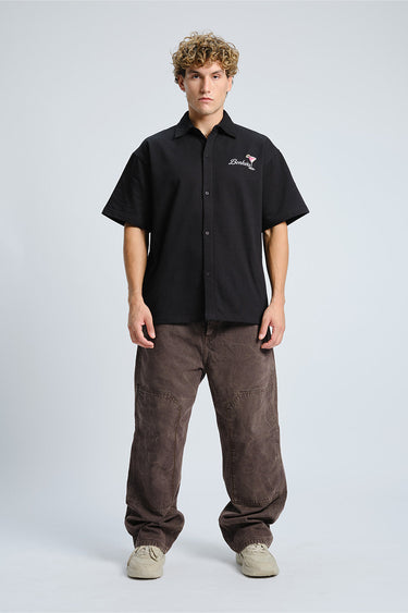 Bonkers Corner Signature Happy Hour oversized shirt in XS, featuring a relaxed fit and casual style, displayed on a hanger.