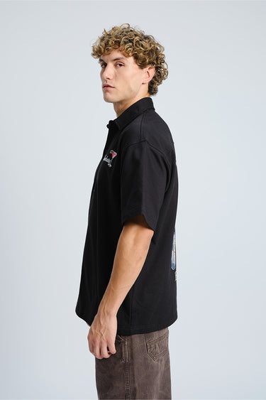 Bonkers Corner Signature Happy Hour oversized shirt in XS, featuring a relaxed fit and bold graphic design.