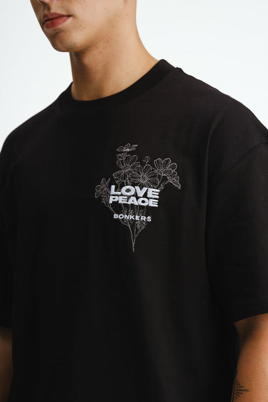 Bonkers Corner Signature Love and Peace oversized premium T-shirt in XS with colorful graphic design on front.