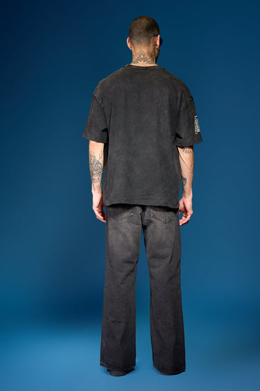 Bonkers Corner Slim Shady oversized T-shirt in white, featuring bold graphic design and relaxed fit, displayed on a hanger.