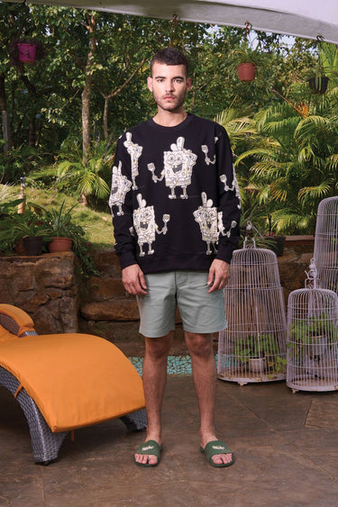 Bonkers Corner SpongeBob sweatshirt with a colorful cartoon print, featuring SpongeBob's face on a cozy, casual fit sweatshirt.