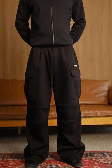 Bonkers Corner Stealth Black 4 Pocket Pant showing the slim fit design and multiple front pockets on a model.