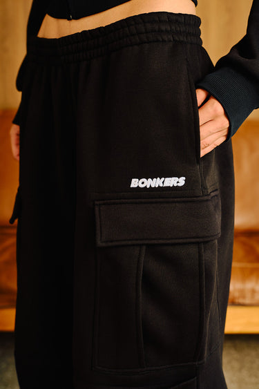 Black Stealth 4 Pocket Pant by Bonkers Corner, showing the slim fit design and four front pockets on a model.