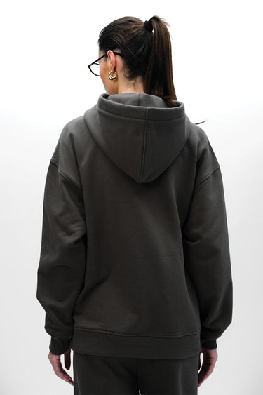 Taupe Wear A Hug oversized hoodie by Bonkers Corner, showing the relaxed fit and soft fabric texture on a model.