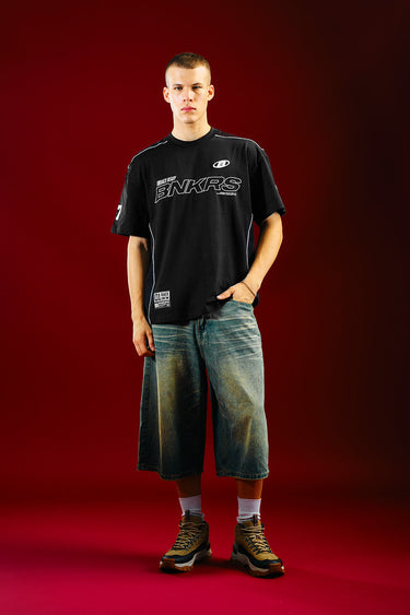 Bonkers Corner Trackside Oversized T-shirt shown in white with bold black graphic design on front.
