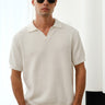 White knit polo T-shirt by Bonkers Corner, featuring a classic collar and short sleeves, displayed on a neutral background.