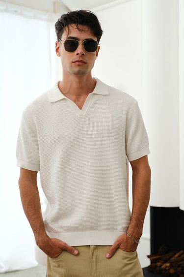 White knit polo T-shirt by Bonkers Corner, featuring a classic collar and short sleeves, displayed on a neutral background.