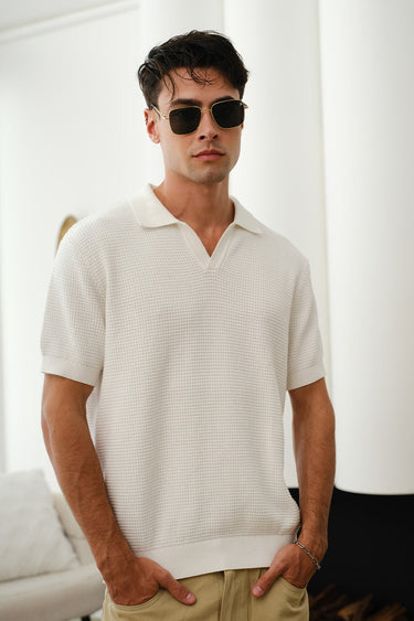 White knit polo T-shirt by Bonkers Corner, featuring a classic collar and short sleeves, displayed on a neutral background.