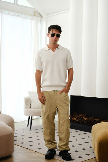 White knit polo T-shirt from Bonkers Corner featuring a classic collar, short sleeves, and a comfortable fit.